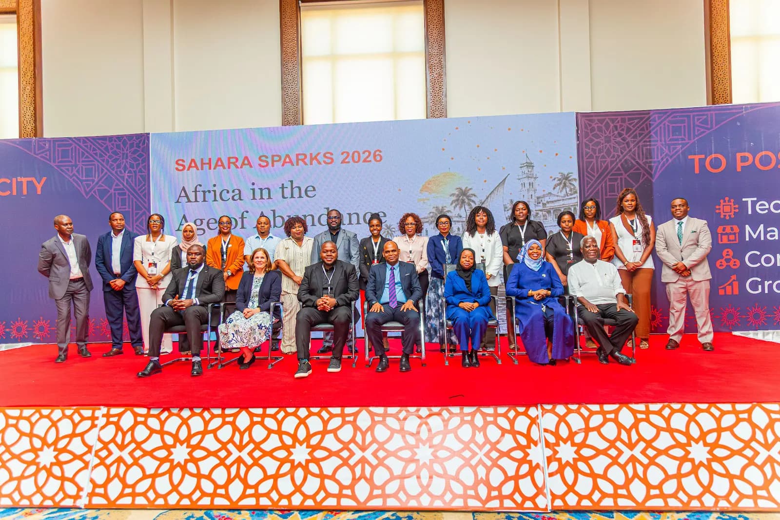 Officials and partners group photo on stage